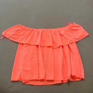 Bright orange crop top.